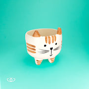 MACETA PATITAS TIGRE CAFE